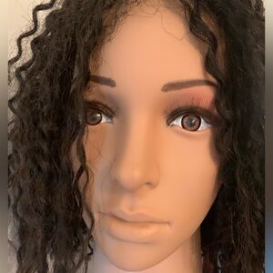 Human hair lace front wig with small twists.